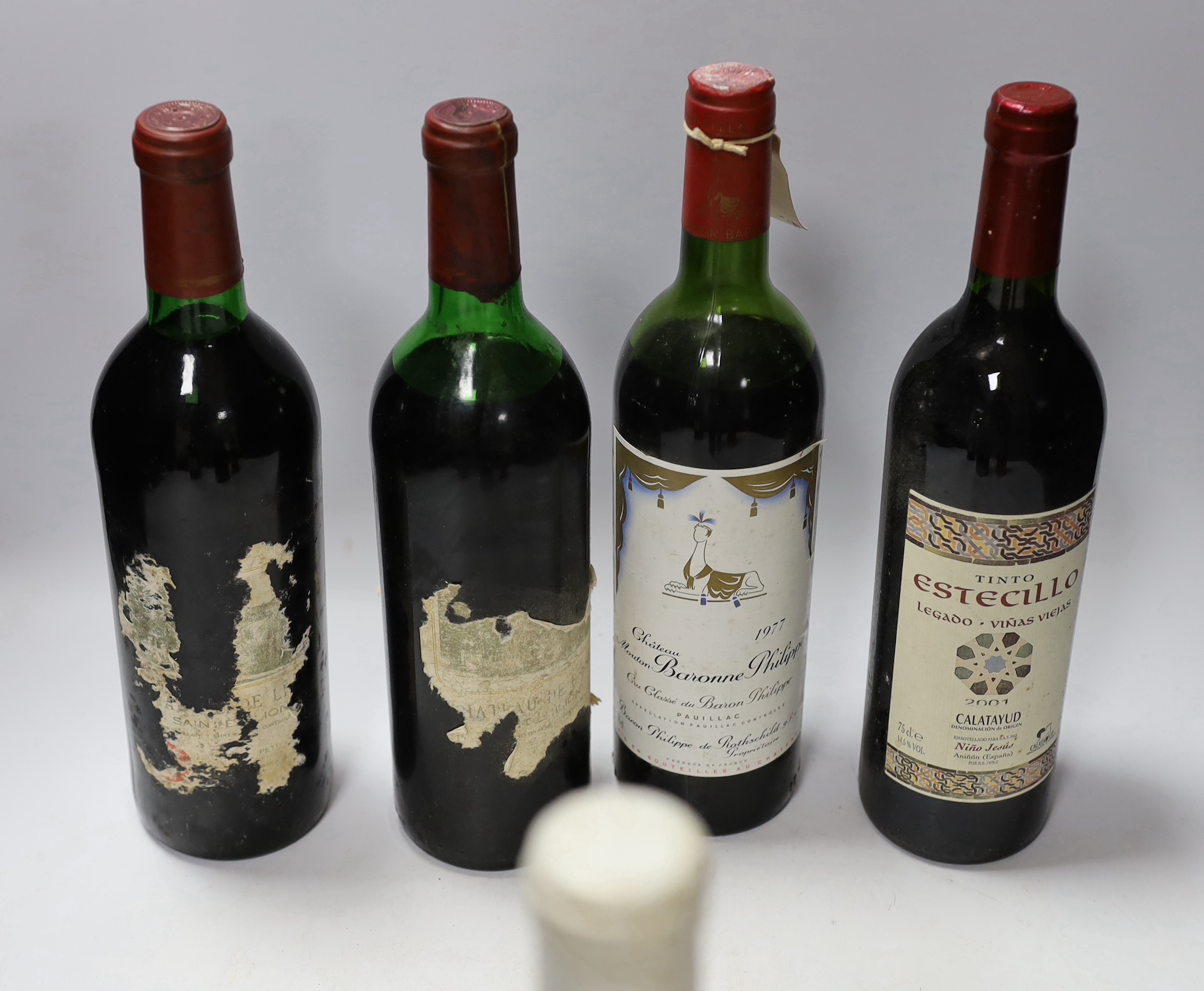 A half bottle of Chateau d'Yquem, 1988, a bottle of Chassagne Montrachet, 1992 and five assorted red wines including Chateau Mouton Baronne Philippe, 1977.